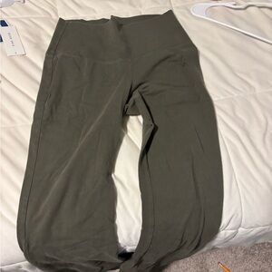 Green flared leggings